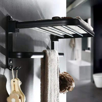 Folding bathroom shelf made of perforated aluminum